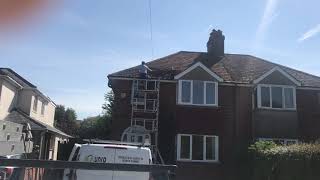 Scraping a roof full of moss using a Flexi Scraper