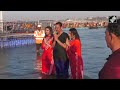 maha kumbh maharashtra cm devendra fadnavis wife amruta fadnavis take holy dip in triveni sangam