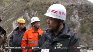 Rescuers clear roads and distribute relief supplies in Tibet