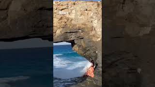 Moment massive wave WIPES OUT tourist posing for photos on rocks