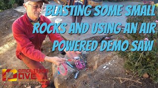 Blasting some small rocks and using an air powered demo saw.