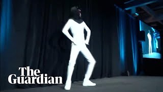 Elon Musk unveils plan for 'Tesla Bot' with man dancing in a bodysuit