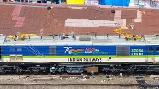 WAP7 37036 UNIQUE SILVER/BLUE/GREEN/WHITE PASSENGER ENGINE IDLES AT YARD