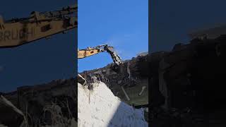 Building demolition with a hydraulic concrete crusher