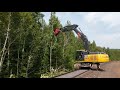 hi rail excavator with brush cutter attachment