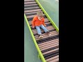 80 slides down the roller slide