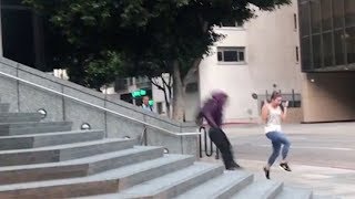 Jogger Runs In Front Of Skateboarder Doing Trick