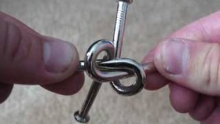 How to solve the twisted nail puzzle in 17 seconds