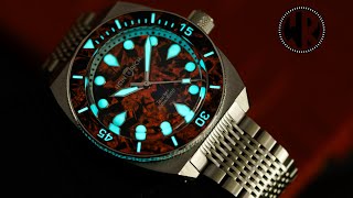 The Heinrich Taucher Lume Infused Forged Carbon Watch. Forged Carbon, wicked lume and retro desgin.