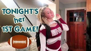 IT'S KATIE CHEERLEADING AT HER FIRST HIGH SCHOOL FOOTBALL GAME