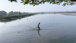 Kadamakkudy.org -  cycling tour - fishing , man collecting  mussels