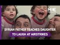 Father teaches Syrian girl to laugh at airstrikes