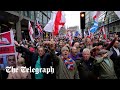 Thousands of Tommy Robinson supporters march through London