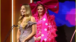 Cate Blanchett presents Margot Robbie with a Trailblazer Award in a whimsical pink Barbie dress .