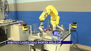 TCAT instructor introduces robotics and manufacturing to students.