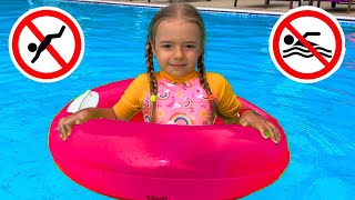 Anabella shows the safety rules in the pool