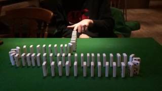 Slow motion dominoes fall