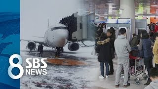 폭설에 묻힌 활주로…제주공항, 새벽 2시까지 연장 운영 / SBS