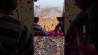 Helicopters are showering flowers on the mass of millions of devotees who are bathing in MahaKumbha