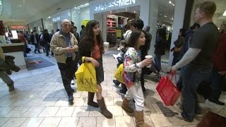 MoneyWatch: Holiday sales meet projections; What to do with unwanted gift cards
