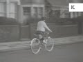 1950s uk girl rides bicycle along suburban street