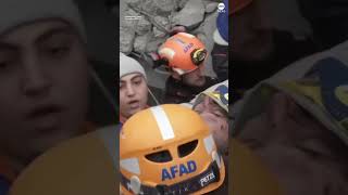 Emergency workers pull a man from the rubble of a collapsed building in Turkey after earthquake