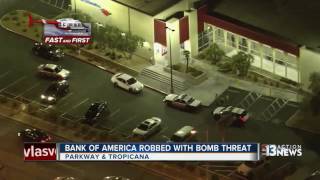 Bank robber threatens employee with a bomb