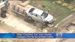 Man Crashes Car Into Home
