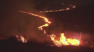 Firefighters battle to maintain the upper hand on a huge fire north of Los Angeles