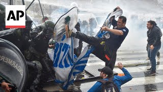 Argentine riot police disperse protesters with water cannons and tear gas ahead