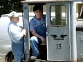 little plymouth engine moving a big shay locomotive