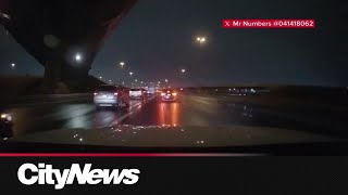 Dashcam footage captures man walking on Highway 401