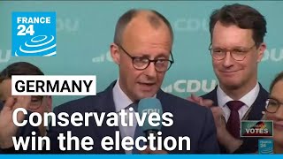 Conservatives win German election while far-right party surges to second place after record gains