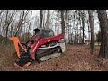 mulching the underbrush out around the bigger trees