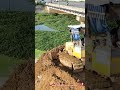 Komatsu D20P Bulldozer Pushing soil into water