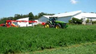 John Deere 8330 and Pöttinger Novacat T8 mower combination in action