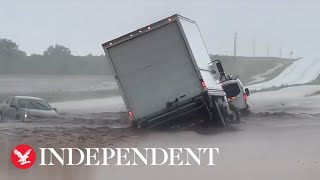 Powerful flash flood submerges and washes vehicles off Texas highway