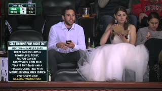 Wedding-dress clad Wild fan enjoys burger at game