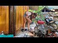 Thiên Tai repairs a machine