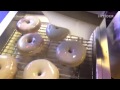 doughnuts being glazed