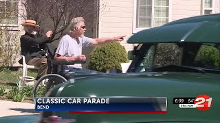 Classic cars parade on Bend street to support friend