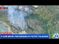 LIVE: Firefighters are battling a brush fire in Palisades