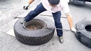 [With subtitles] really? Replace tires for large vehicles with human power.