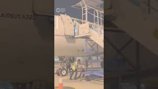 Airport Worker Falls From Plane at Airport in Indonesia | 10 News First