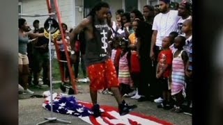 Lil' Wayne steps on flag and into trouble