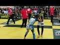 lower grey belt BJJ girl quickly submits orange belted boy with incredible arm bar/triangle choke.