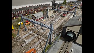 Large 40ft loft layout OO gauge model railway. Installing West Hill Wagon Works Cantenary.