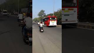 two crossing electric bus vs standard bus aapli bus nagpur