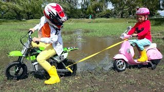 Max and Katy stuck in mud on the motorbike