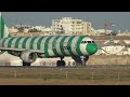 condor airbus a321 green stripes landing and takeoff at sunset at faro airport